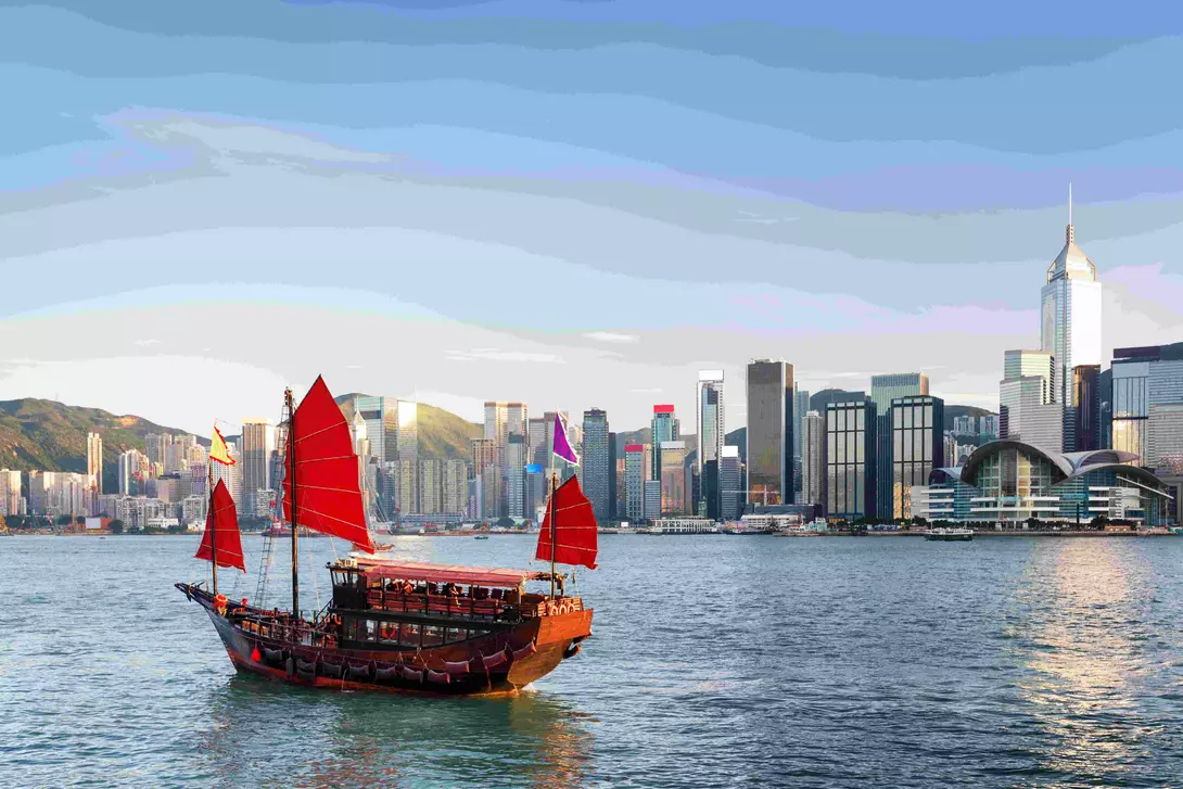 Scenic view of a traditional Chinese junk in Victoria harbor, Hong Kong.