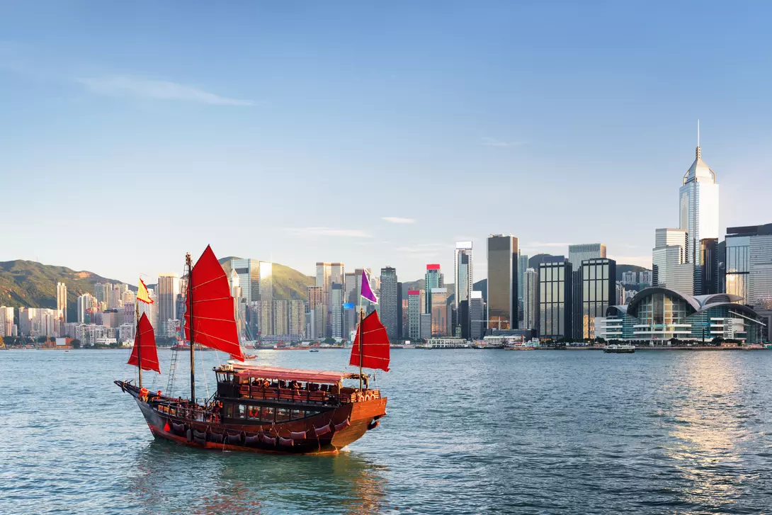 Scenic view of a traditional Chinese junk in Victoria harbor, Hong Kong.