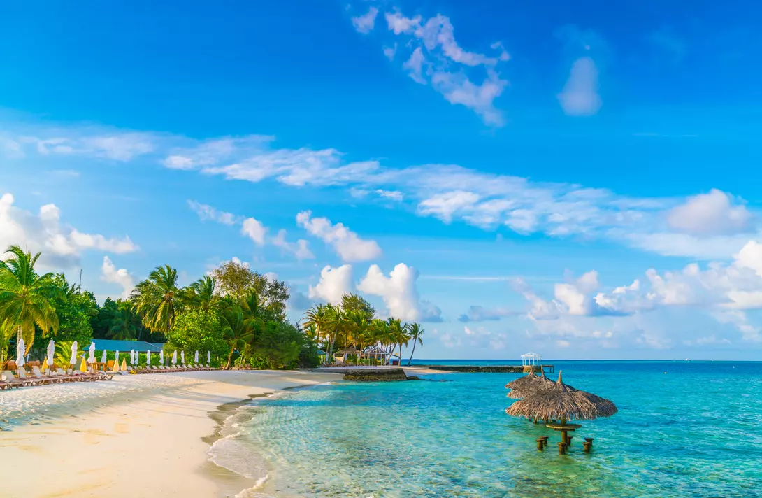 Beautiful tropical Maldives island with white sandy beach and sea