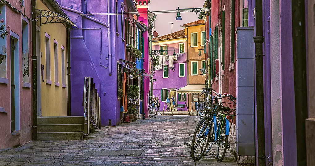 Escape the busy streets of Venice to tour the Pastel Buildings of Burano Island in the Venetian Lagoon Escape the busy streets of Venice to tour the Pastel Buildings of Burano Island in the Venetian Lagoon