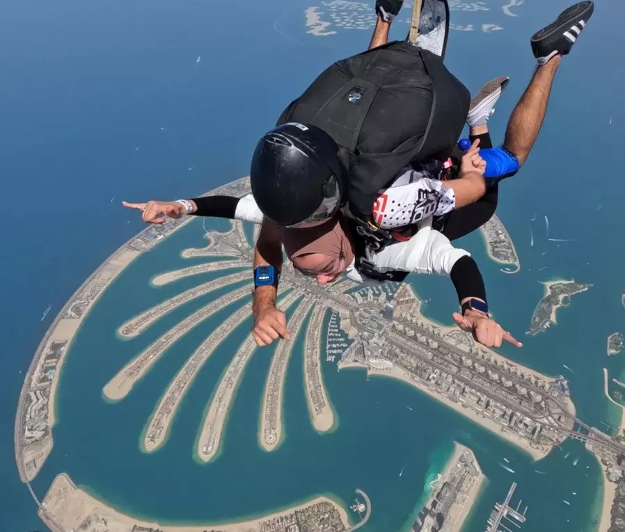 An employee skydiving in Dubai