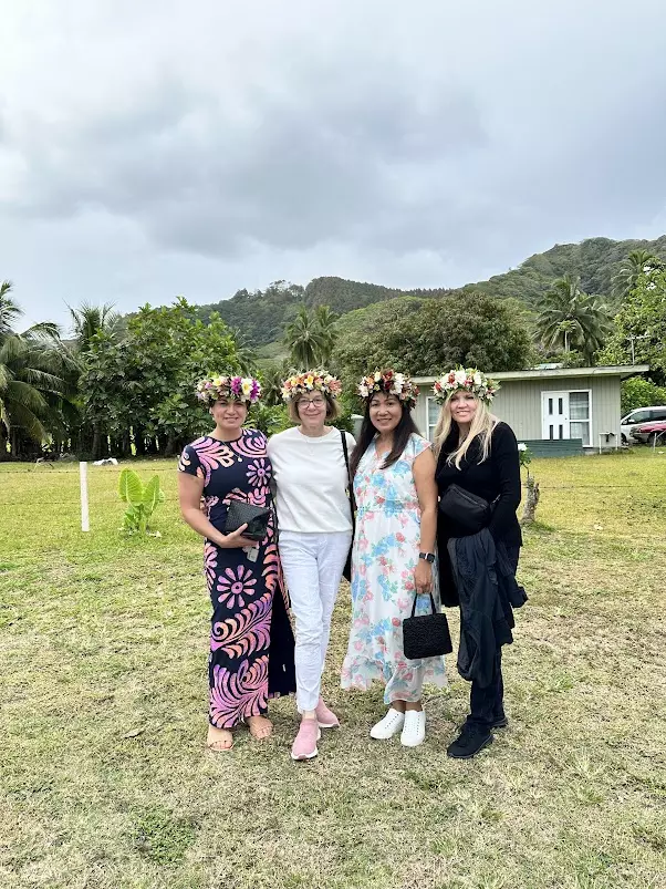 A group standing together wearing flower crowns