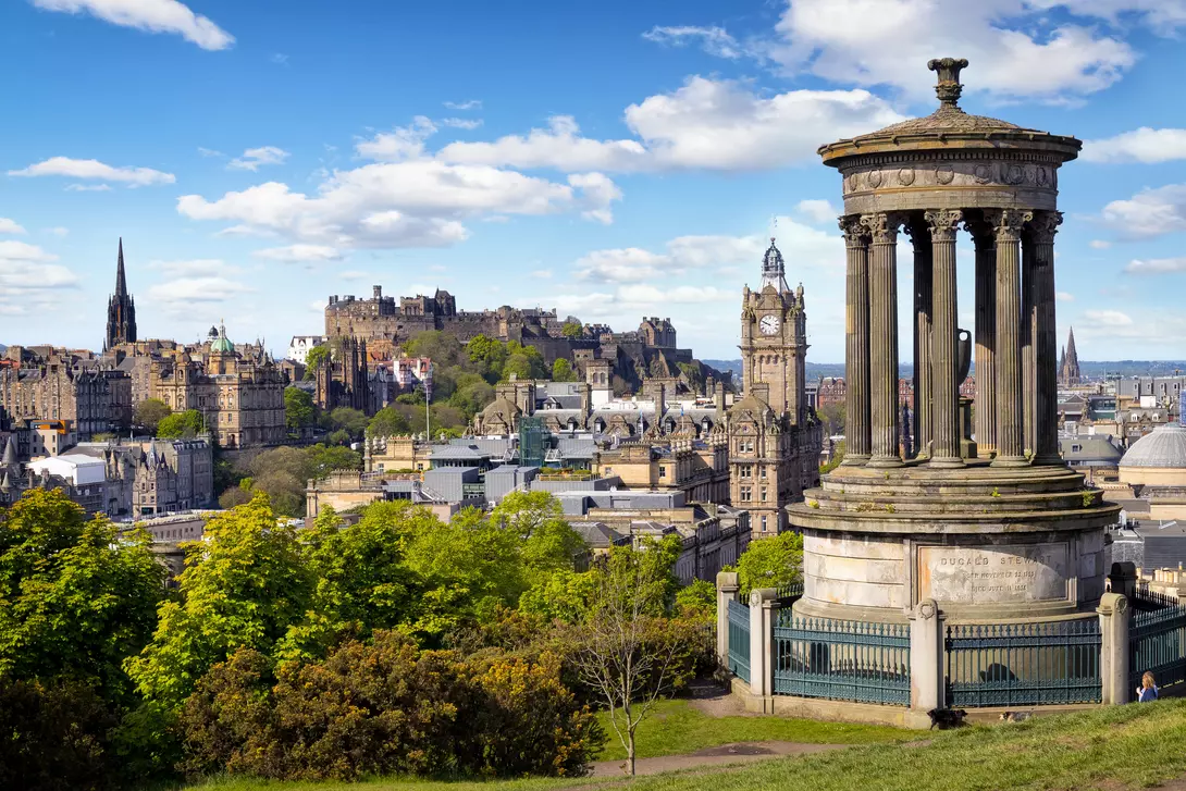Dugald Stewart Monument and view over historic Edinburgh from Calton Hill