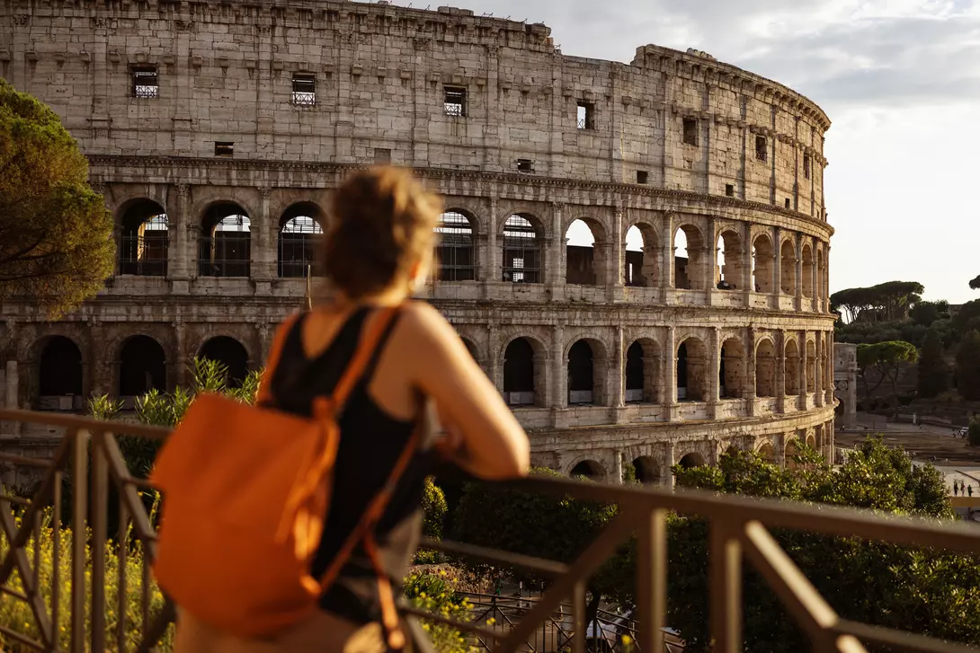 Tourist woman in Rome by the Coliseum