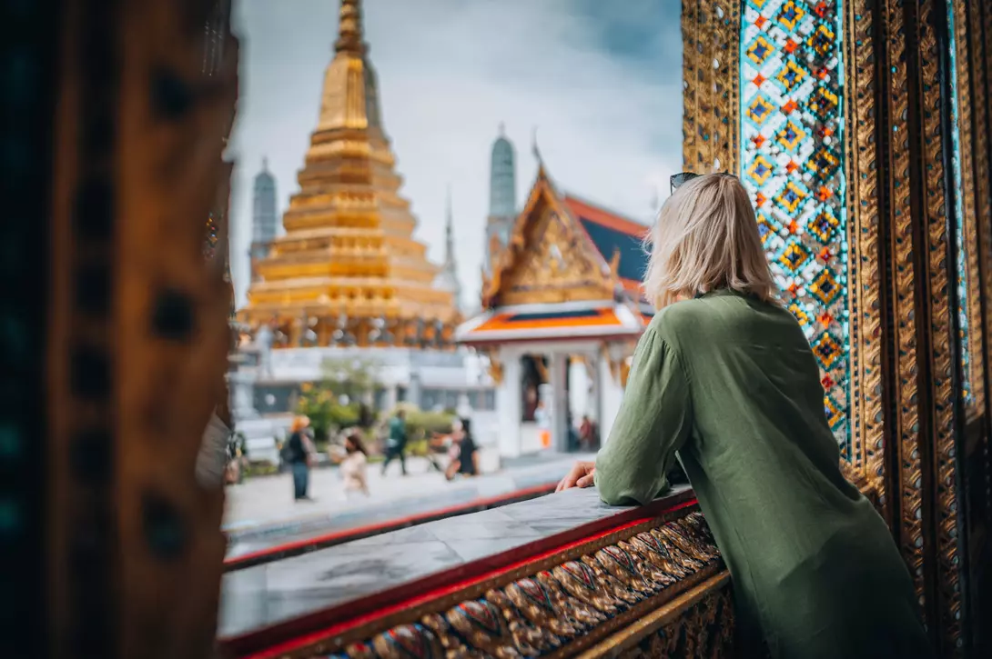 Woman exploring Grand Palace and Wat Phra Kaew in Bangkok, Thailand