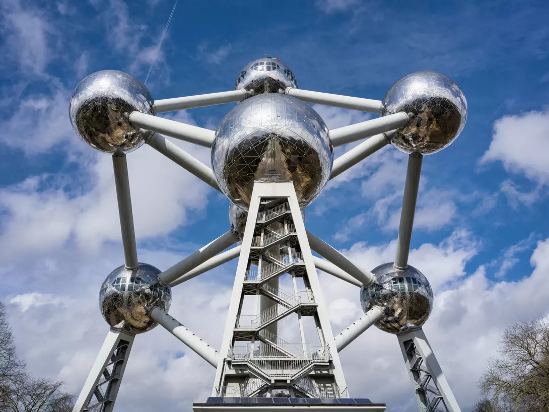 Atomium Structure in Brussels under blue summer sky, shot from below.