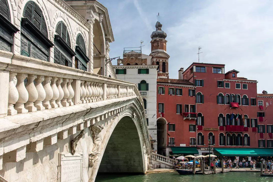 People walking near the Rialto Bridge on the Grand Canal at Venice, Italy