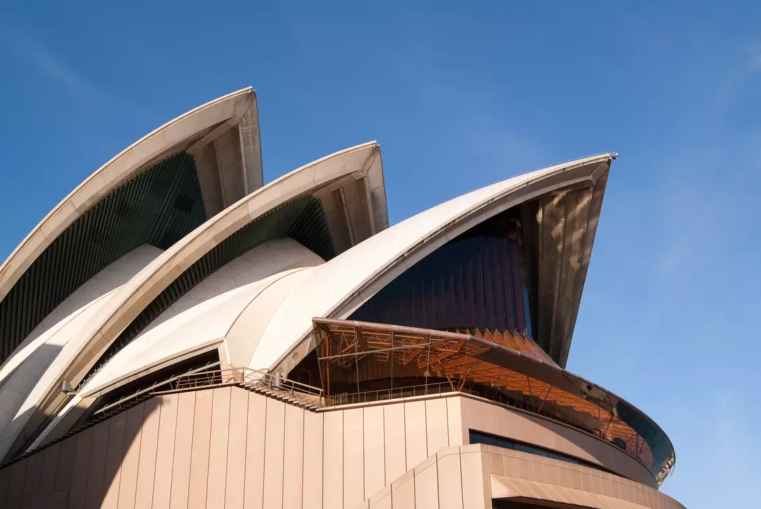 A section of the iconic sails of the Sydney Opera House, seen from the northern side on a bright morning