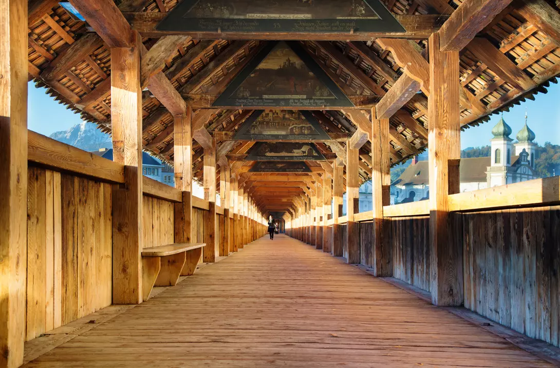 Chapel bridge interior with paintings hanging from the ceiling