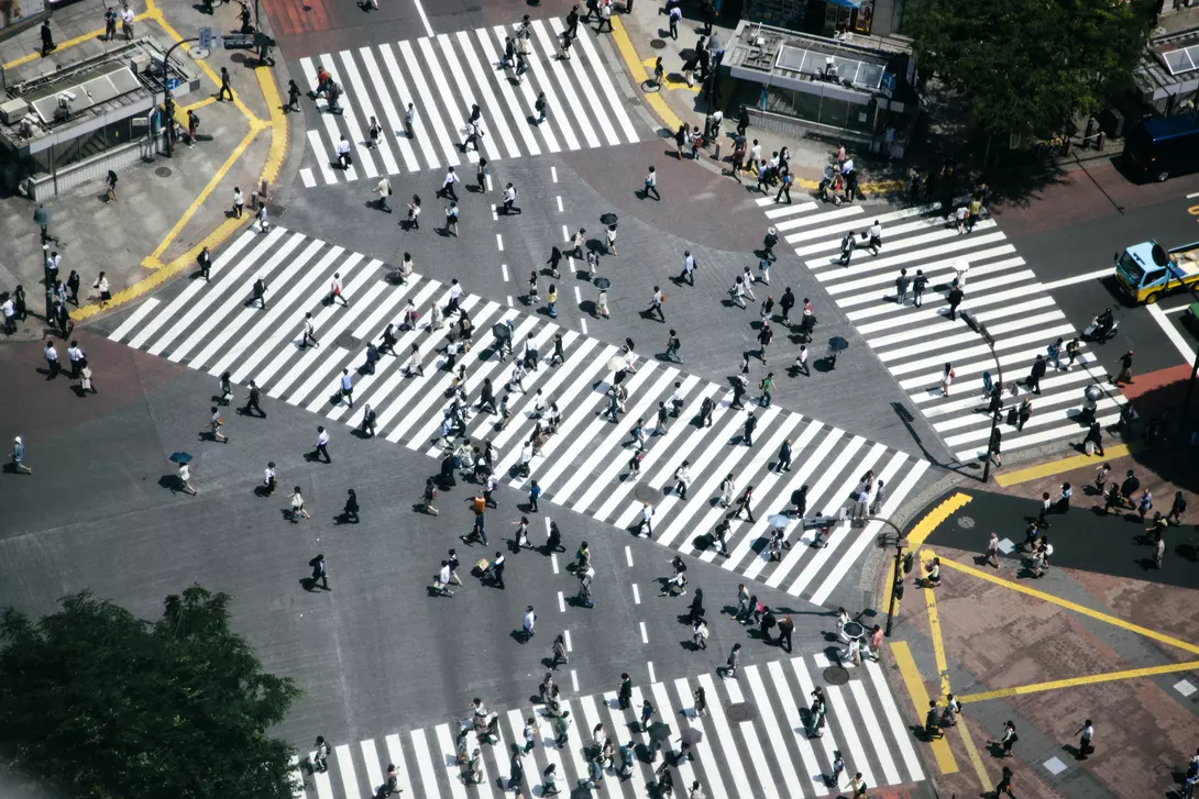 Shibuya Crossing, Tokyo, Japan Shibuya crossing, pedestrians crossing the road, aerial view. Spring, daylight