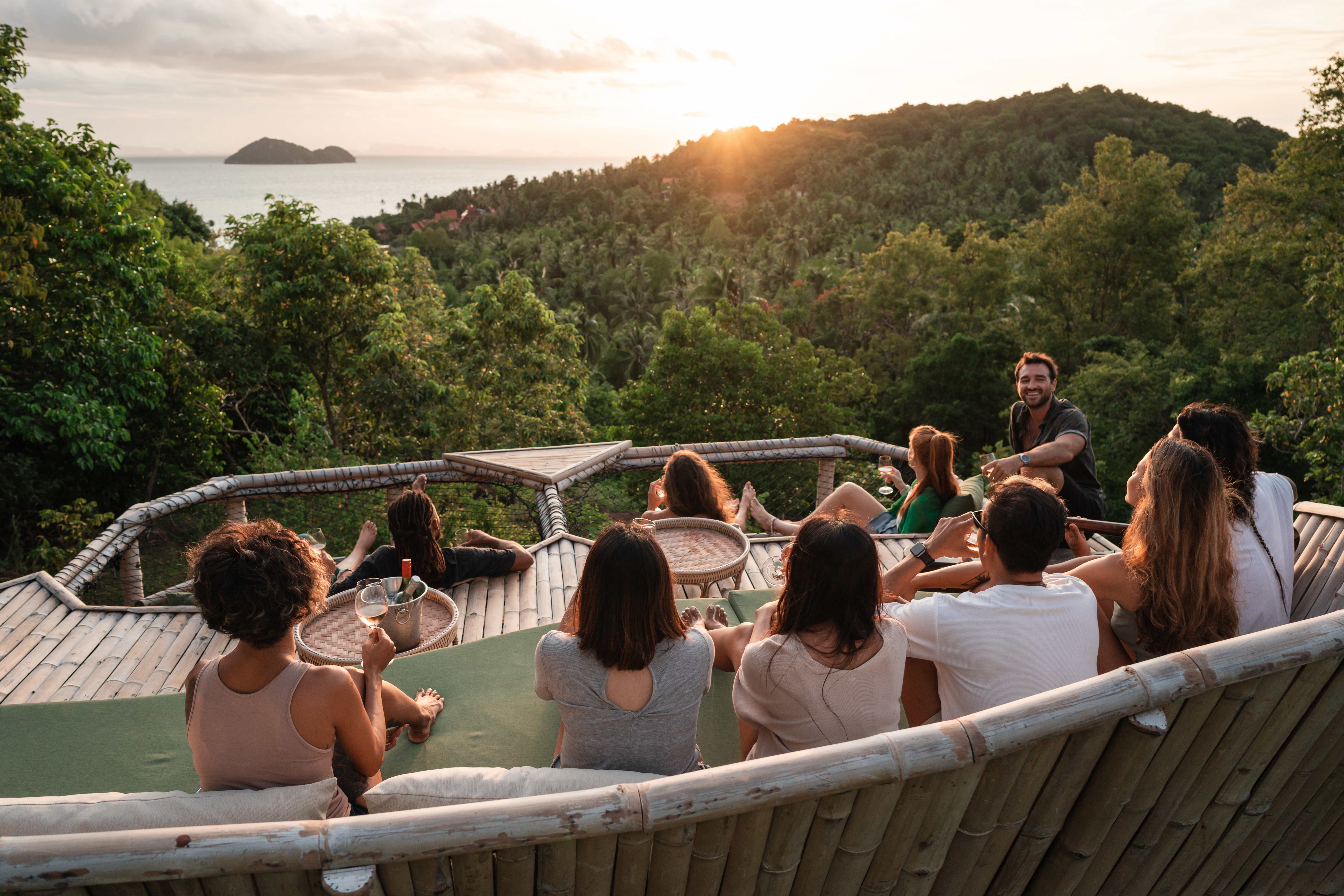 Group enjoys watching a sunset from a viewpoint
