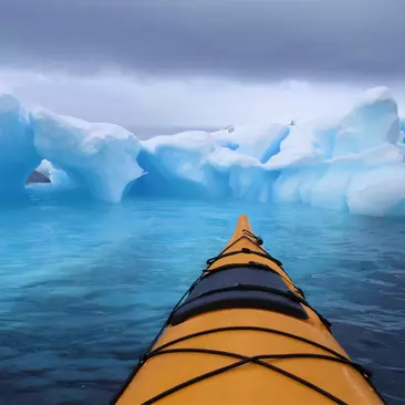 A kayak amongst the icebergs, Antarctic