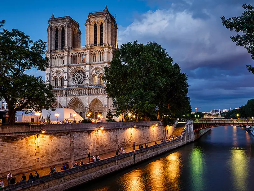 Appreciate the work behind the gothic architecture of Notre Dame de Paris