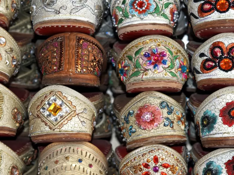 Rack of traditional Indian shoes made of camel skins