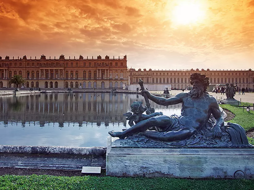 Step outside of Paris to visit royalty at the extravagant Palace of Versailles