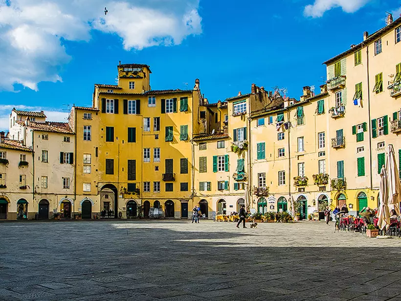 Explore the open plaza of Piazza Anfiteatro in the walled city of Lucca